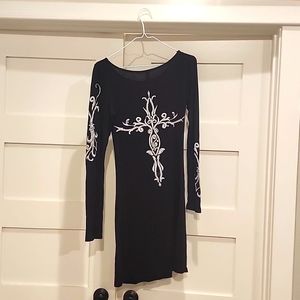 Black dress with stitched white cross